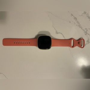 Fitbit Versa 3 with charging cable